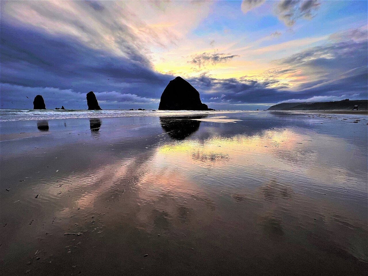 Haystack Rock rising from the ocean at Cannon Beach, Oregon.