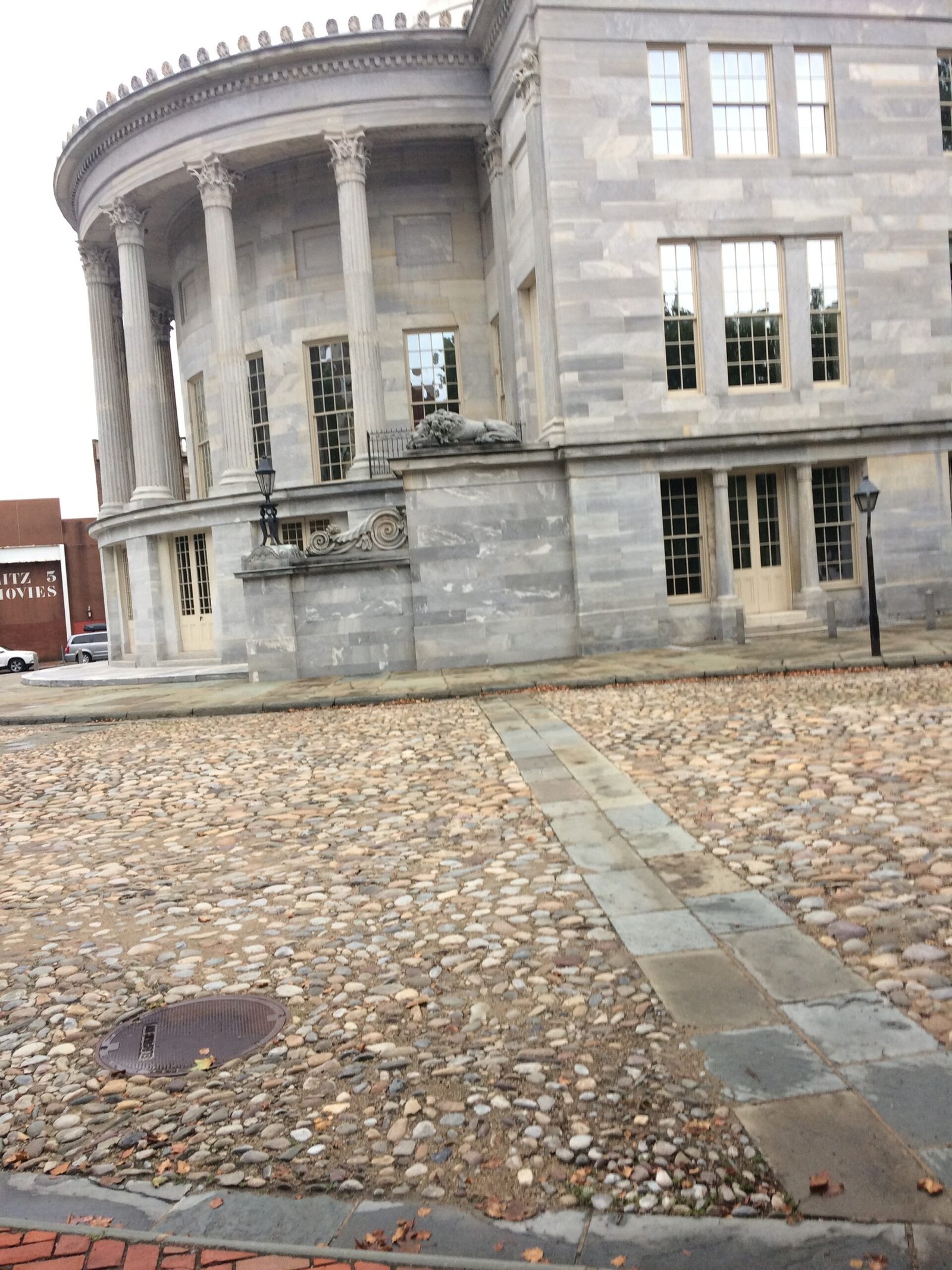 Cobblestone street in front of a historic stone building in Philadelphia, Pennsylvania.