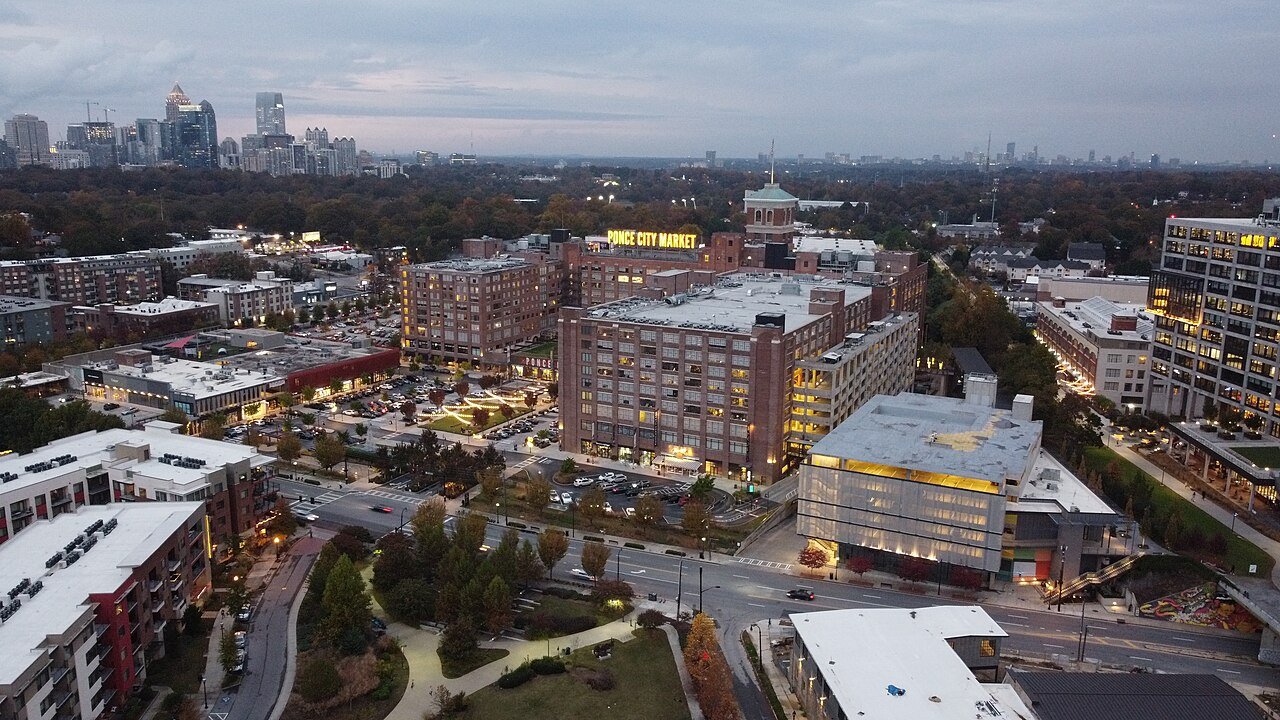 Ponce City Market and surrounding Atlanta buildings at dusk.